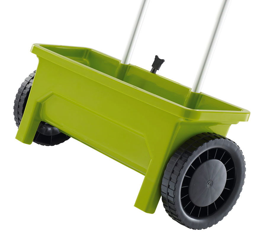 Grøn gødningsspreder på hjul til haven