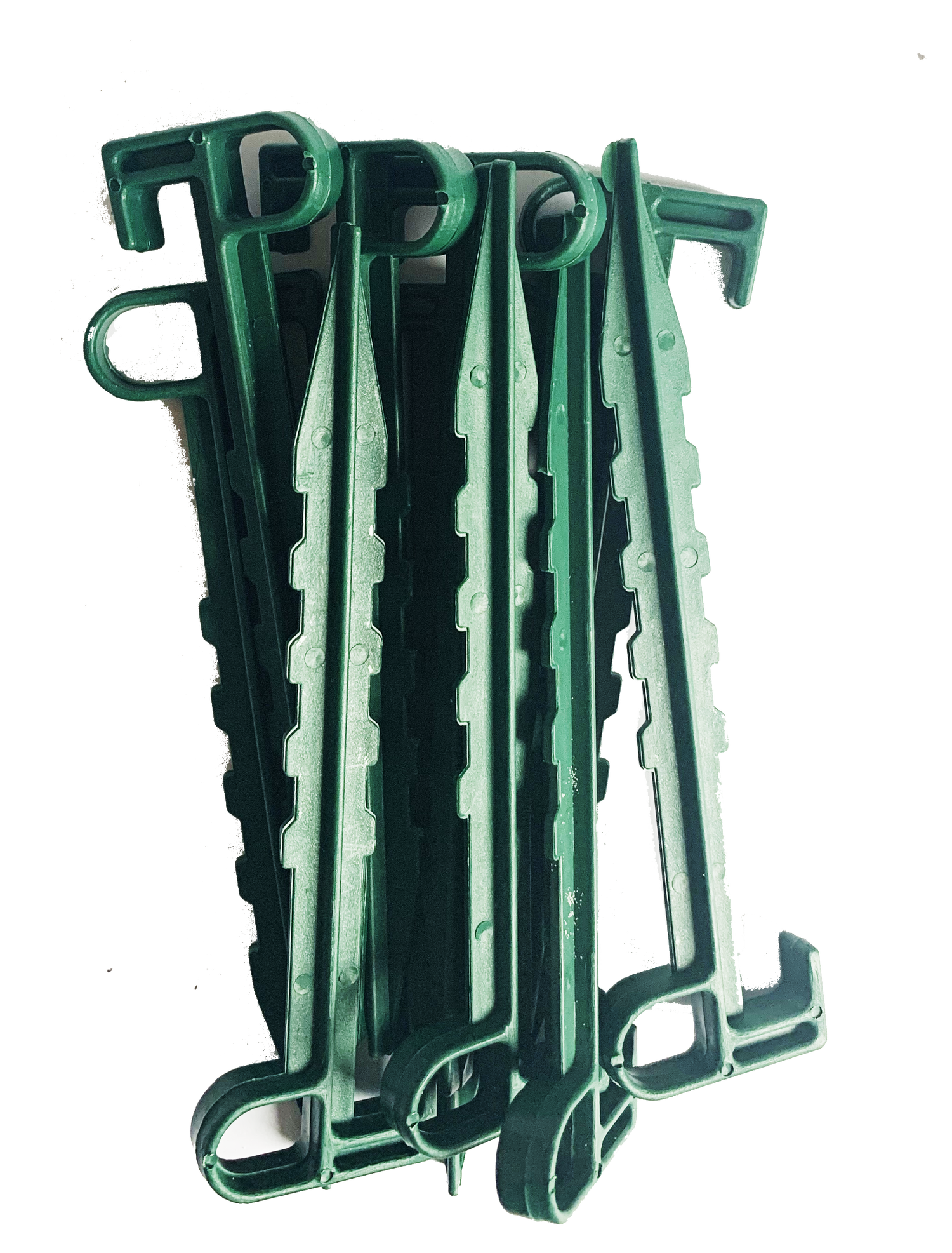 Sæt grønne plastpløkker til fastgørelse i haven